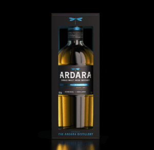 A bottle of Ardara Single Malt Irish Whiskey (2025 Edition) is displayed inside a sleek black presentation box with a window. The box features a teal dragonfly logo at the top and the text "Distilled at THE ARDARA DISTILLERY" at the bottom.