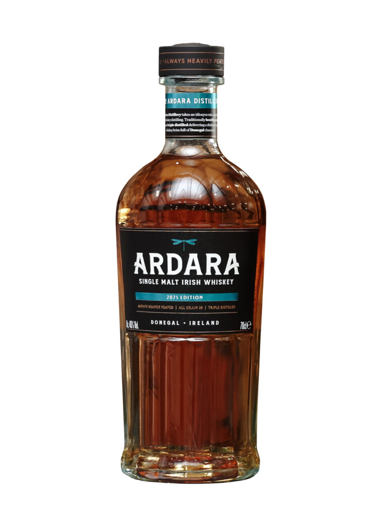 A bottle of Ardara Single Malt Irish Whiskey (2025 Edition) stands alone against a plain white background. The clear glass bottle reveals an amber-colored spirit and features a black label with a teal dragonfly logo. Text on the label identifies it as "Always Heavily Peated," "Triple Distilled," and from Donegal, Ireland.