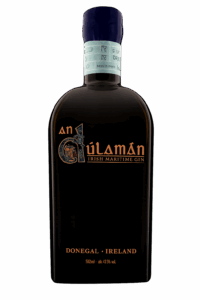 A dark, opaque bottle of An Dúlamán Irish Maritime Gin from Donegal, Ireland. The bottle features elegant orange and gold typography and is presented against a plain white background.